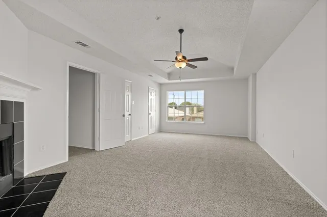 a view of empty room with windows