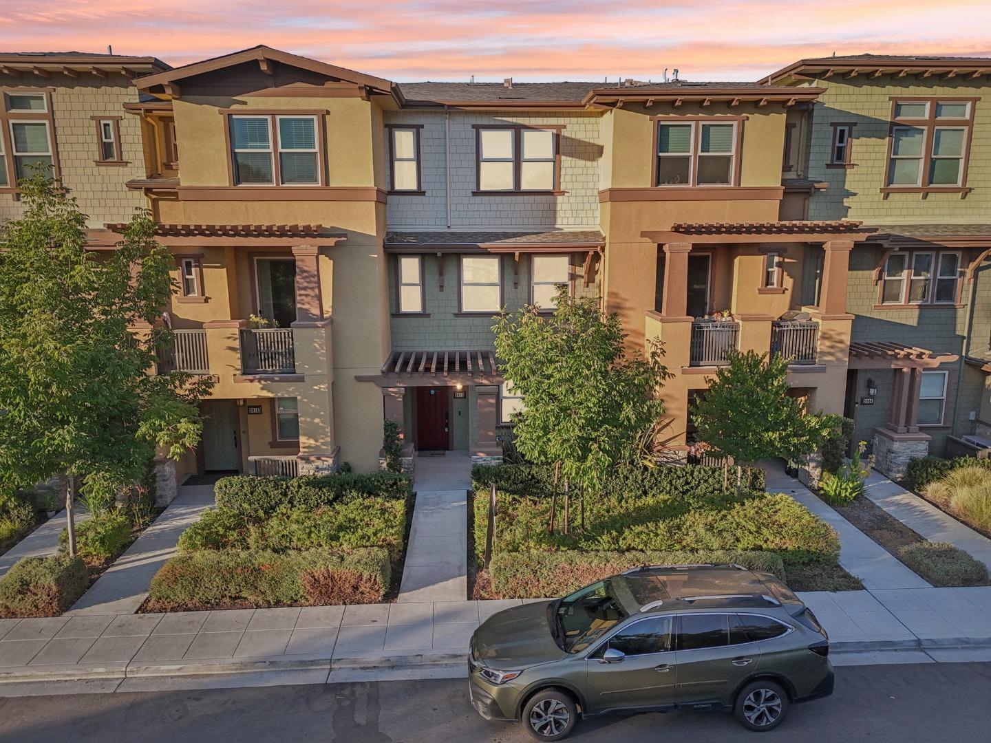 a car parked in front of a brick house