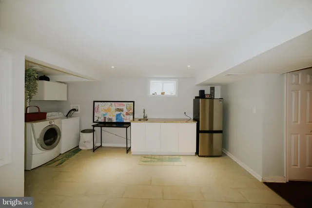 a view of a kitchen with a sink stove and cabinets
