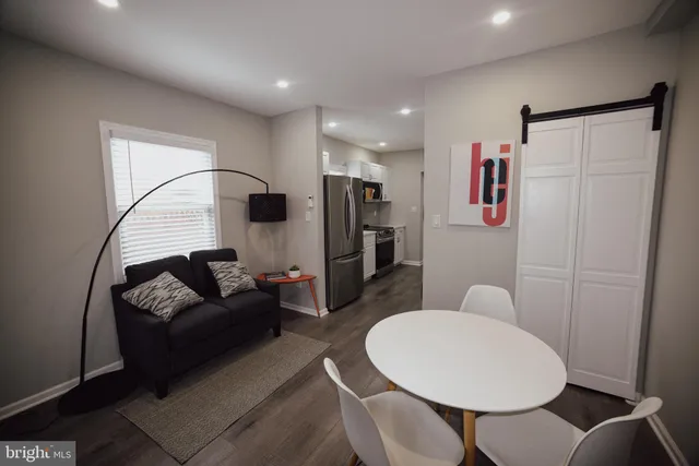 a kitchen with stainless steel appliances granite countertop a refrigerator and a stove