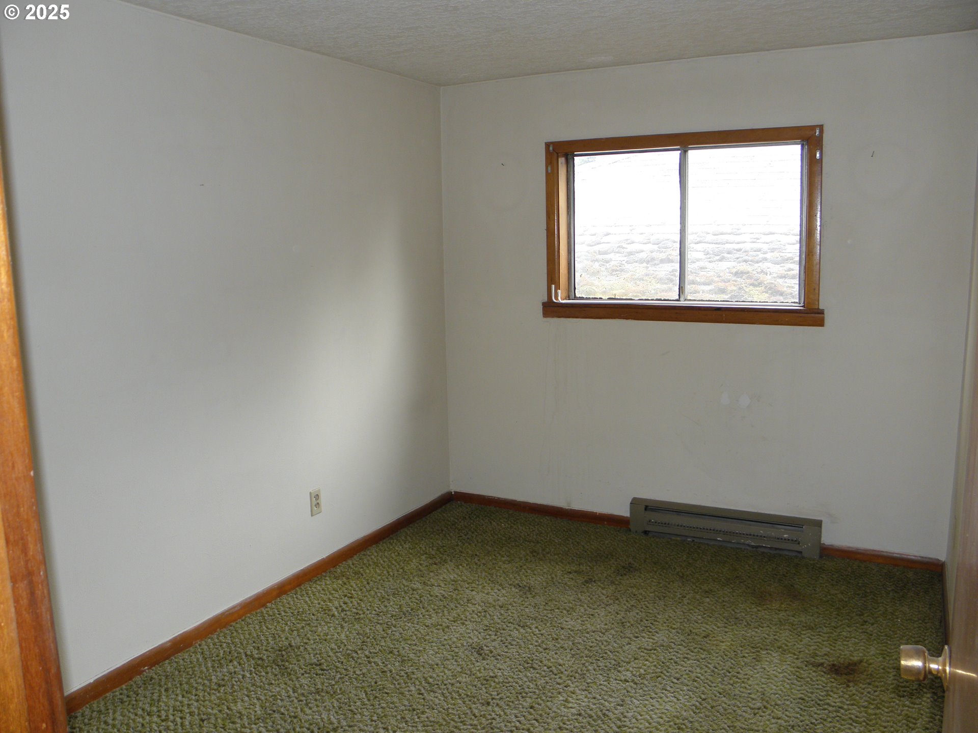 6640 Southeast 66th Avenue Portland, OR 97206 - Photo 15 of 21 an empty room with a window