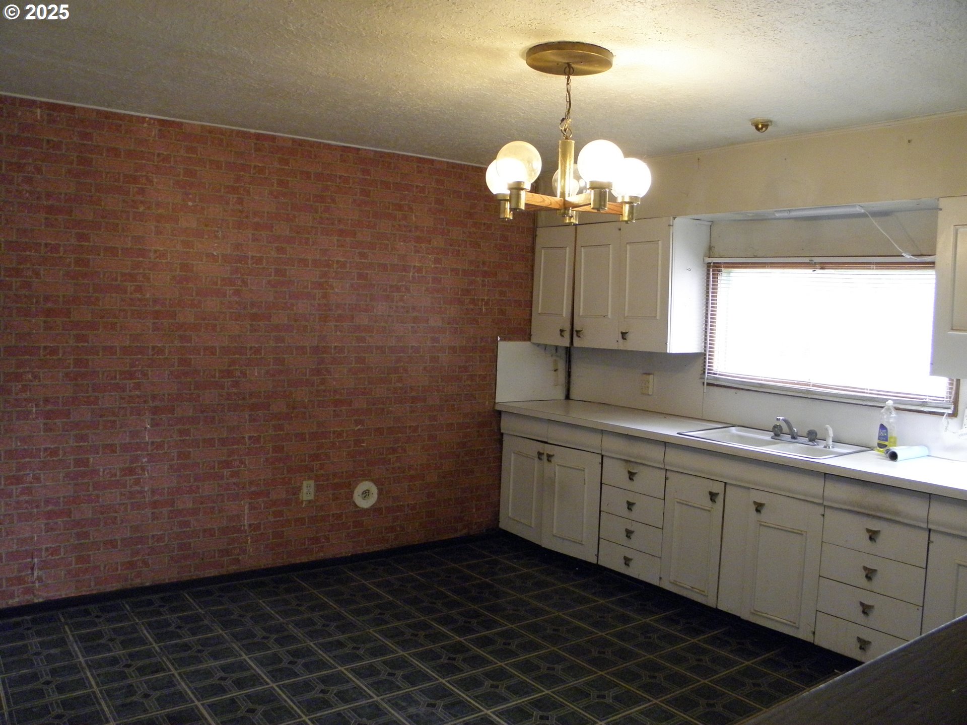 6640 Southeast 66th Avenue Portland, OR 97206 - Photo 4 of 21 a view of a bathroom with a double vanity sink and a window