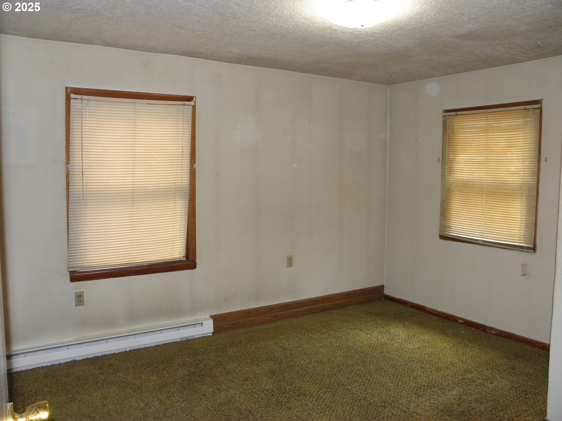 6640 Southeast 66th Avenue Portland, OR 97206 - Photo 9 of 21 an empty room with a window