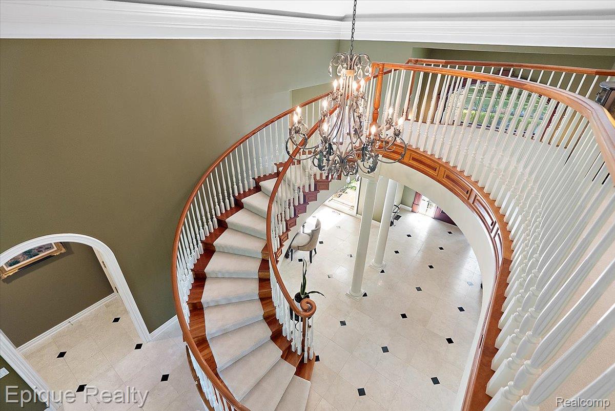 7662 Devins Ridge Clarkston, MI 48348 - Photo 53 of 81 Grand curved staircase featuring wood treads and white balusters