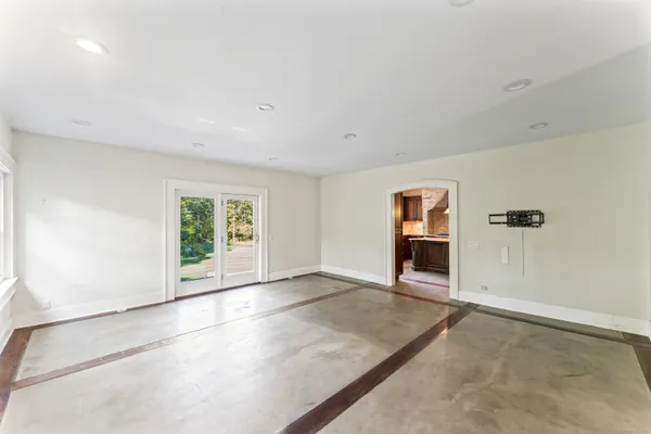 an empty room with windows and an empty room