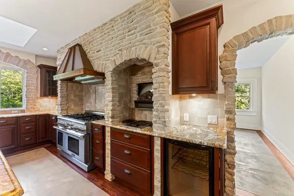 a kitchen with a refrigerator and countertop