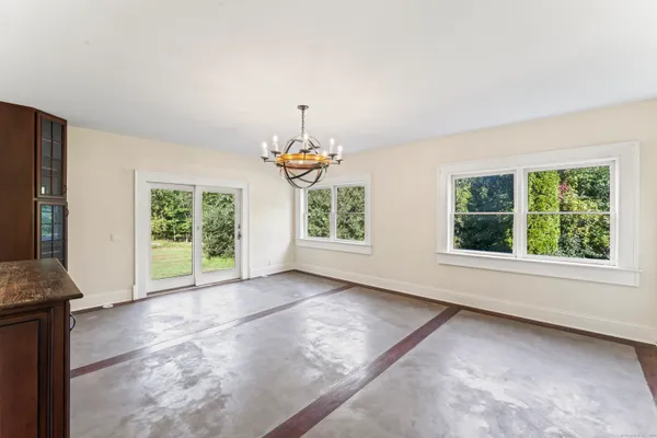 a view of an entryway with wooden floor and windows