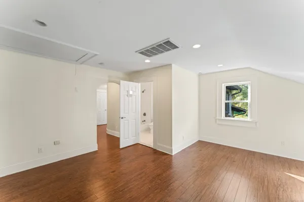 a bathroom with double vanity sink and a mirror