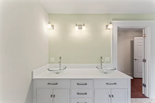 a bathroom with a glass shower door