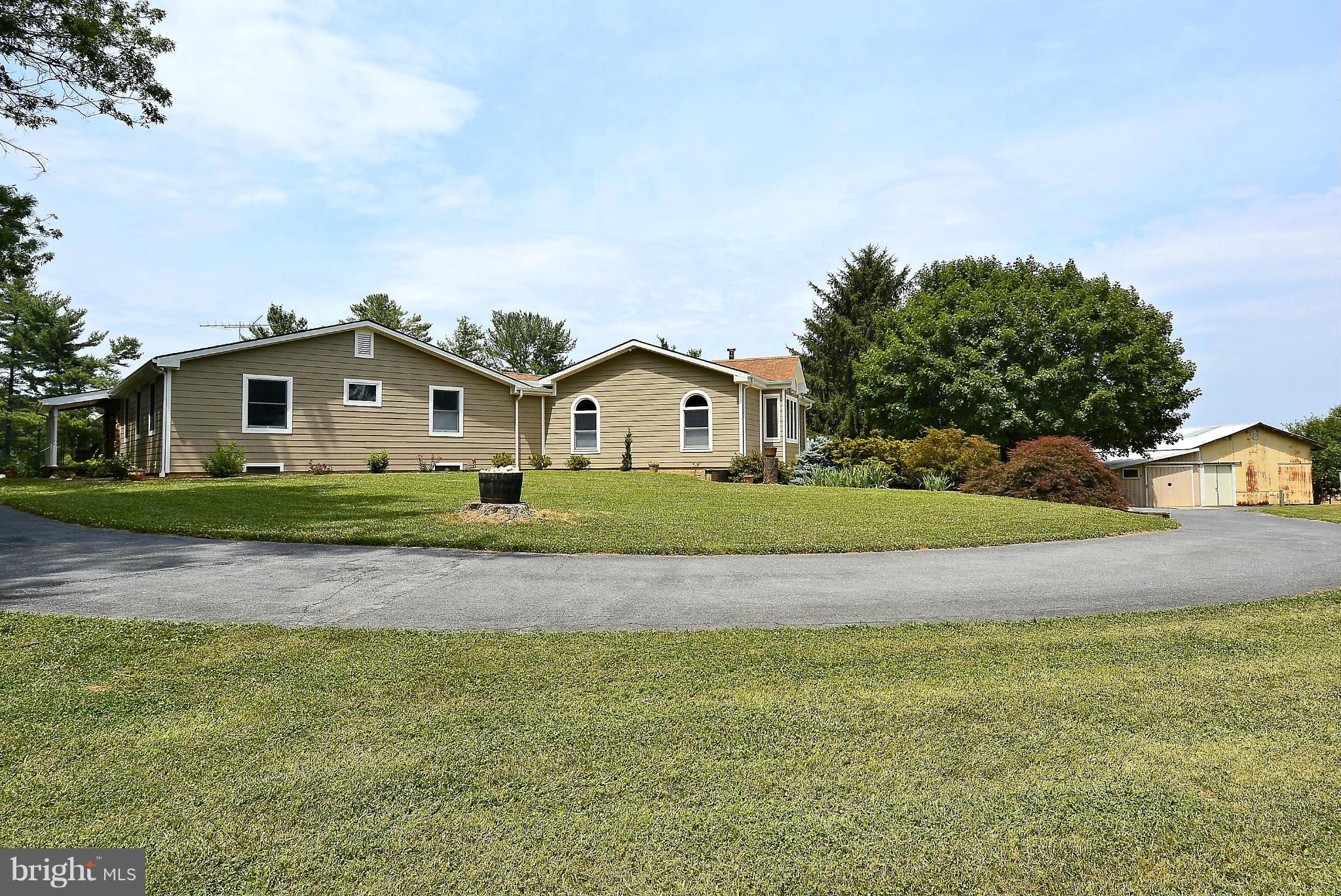 21121 Peach Tree Road Dickerson, MD 20842 - Photo 2 of 30 a view of white house with a big yard and large trees