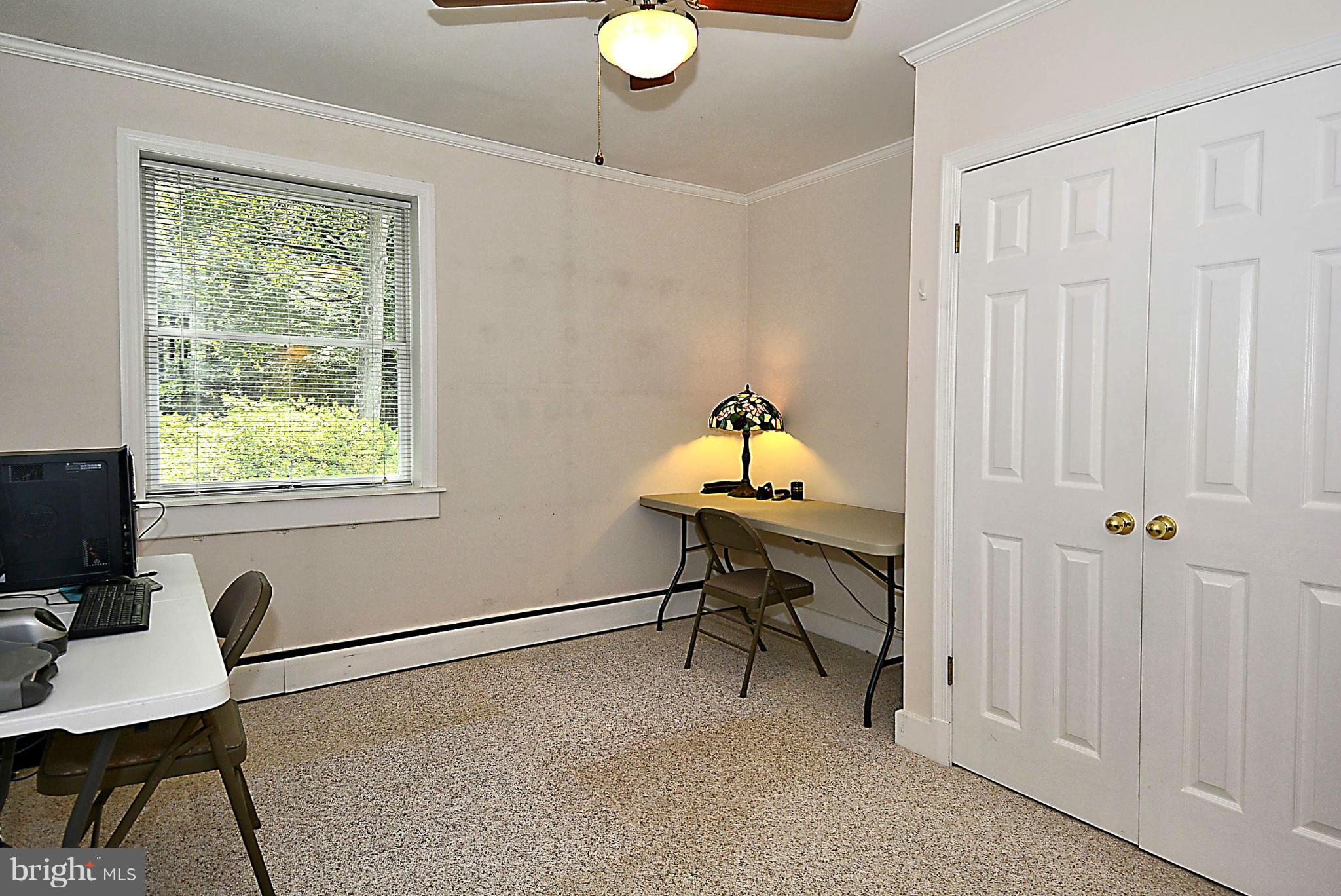 21121 Peach Tree Road Dickerson, MD 20842 - Photo 18 of 30 a view of a workspace with furniture and a window