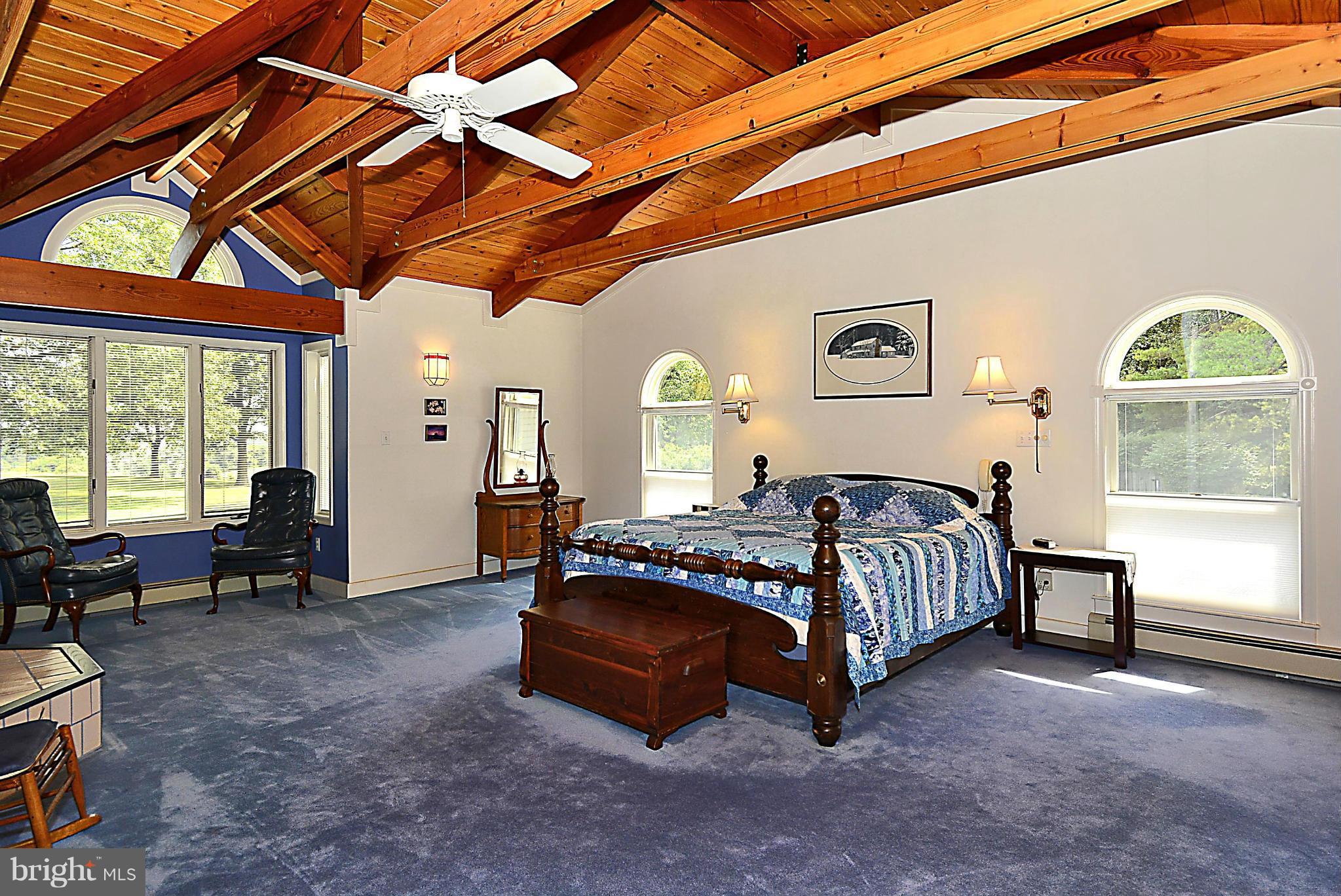 21121 Peach Tree Road Dickerson, MD 20842 - Photo 19 of 30 a spacious bedroom with a bed and a large window