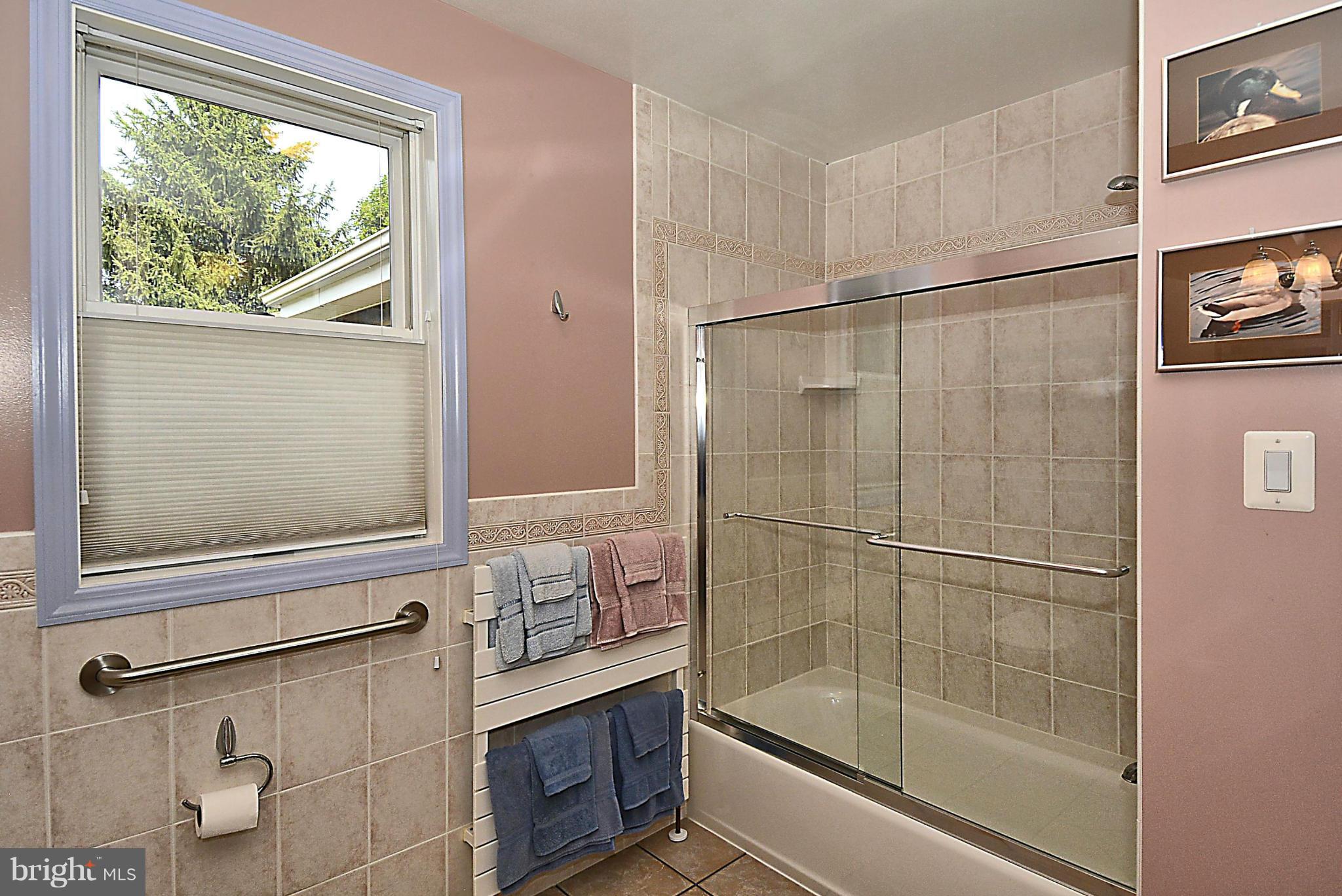 21121 Peach Tree Road Dickerson, MD 20842 - Photo 25 of 30 a bathroom with a bathtub and a shower