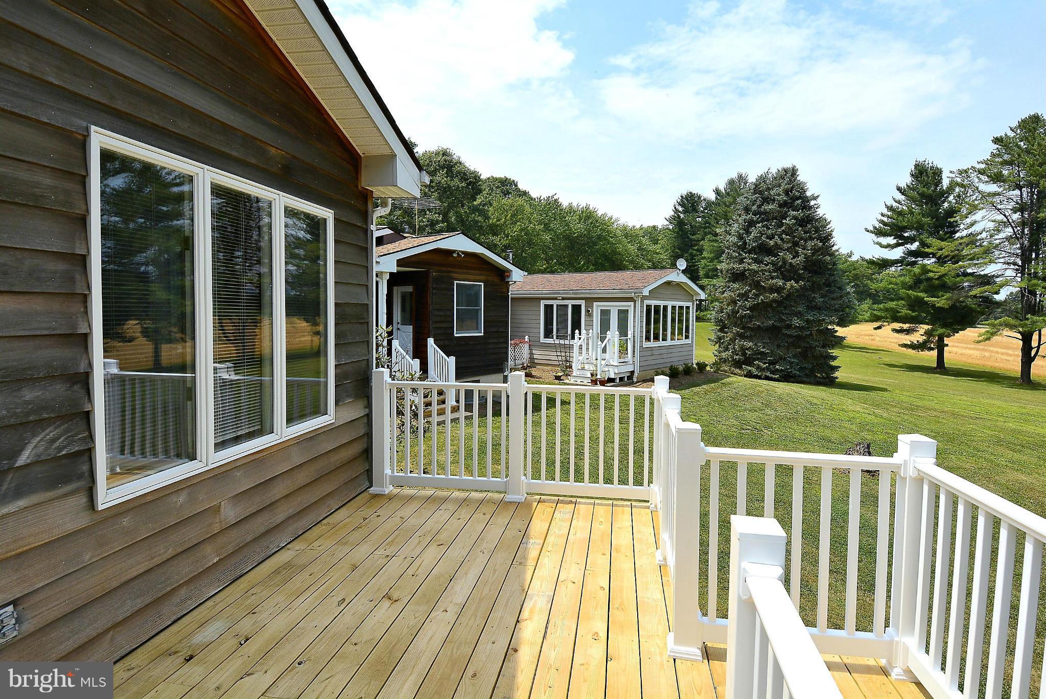 21121 Peach Tree Road Dickerson, MD 20842 - Photo 27 of 30 a view of a house with wooden deck