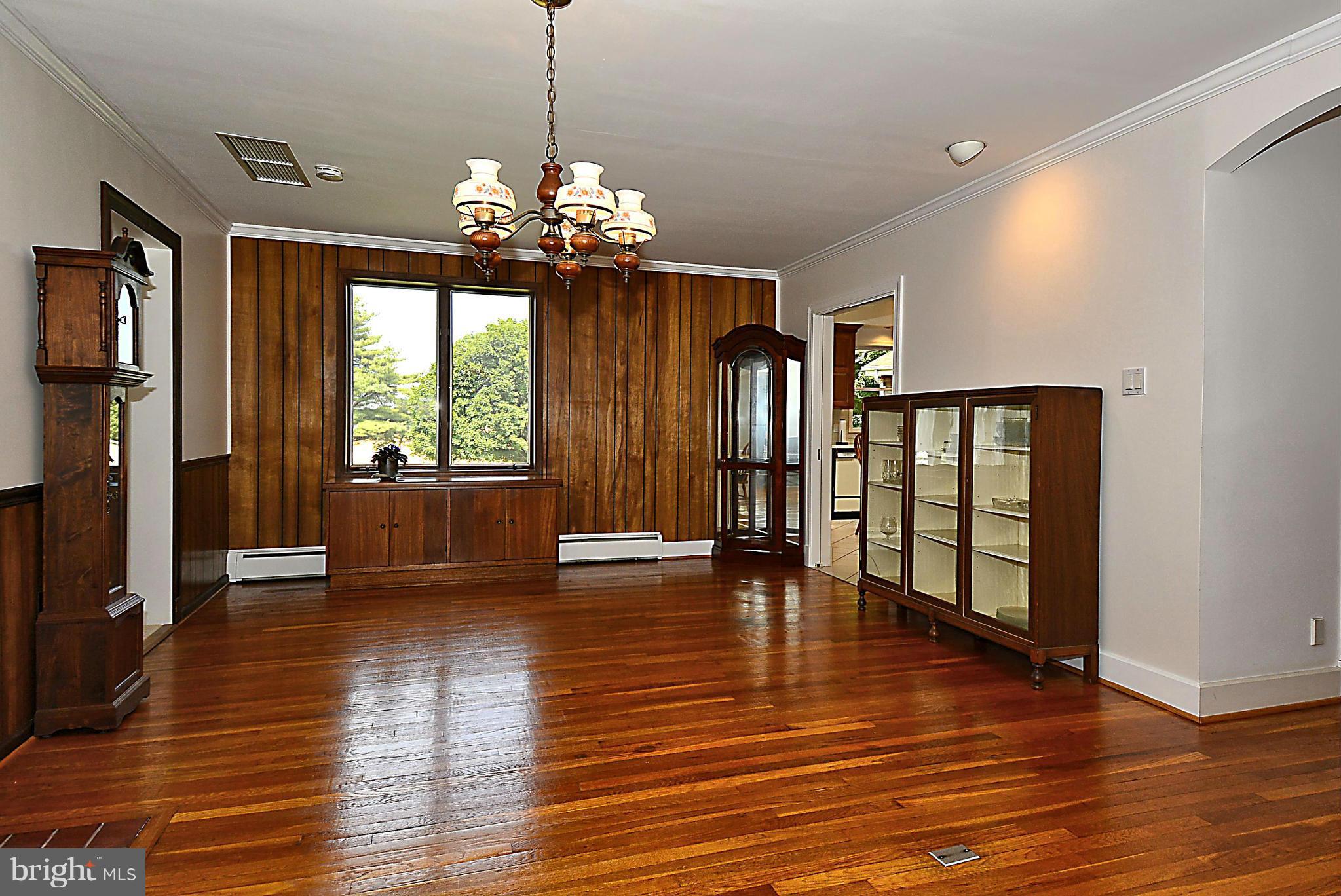 21121 Peach Tree Road Dickerson, MD 20842 - Photo 4 of 30 a view of an empty room with wooden floor and a window