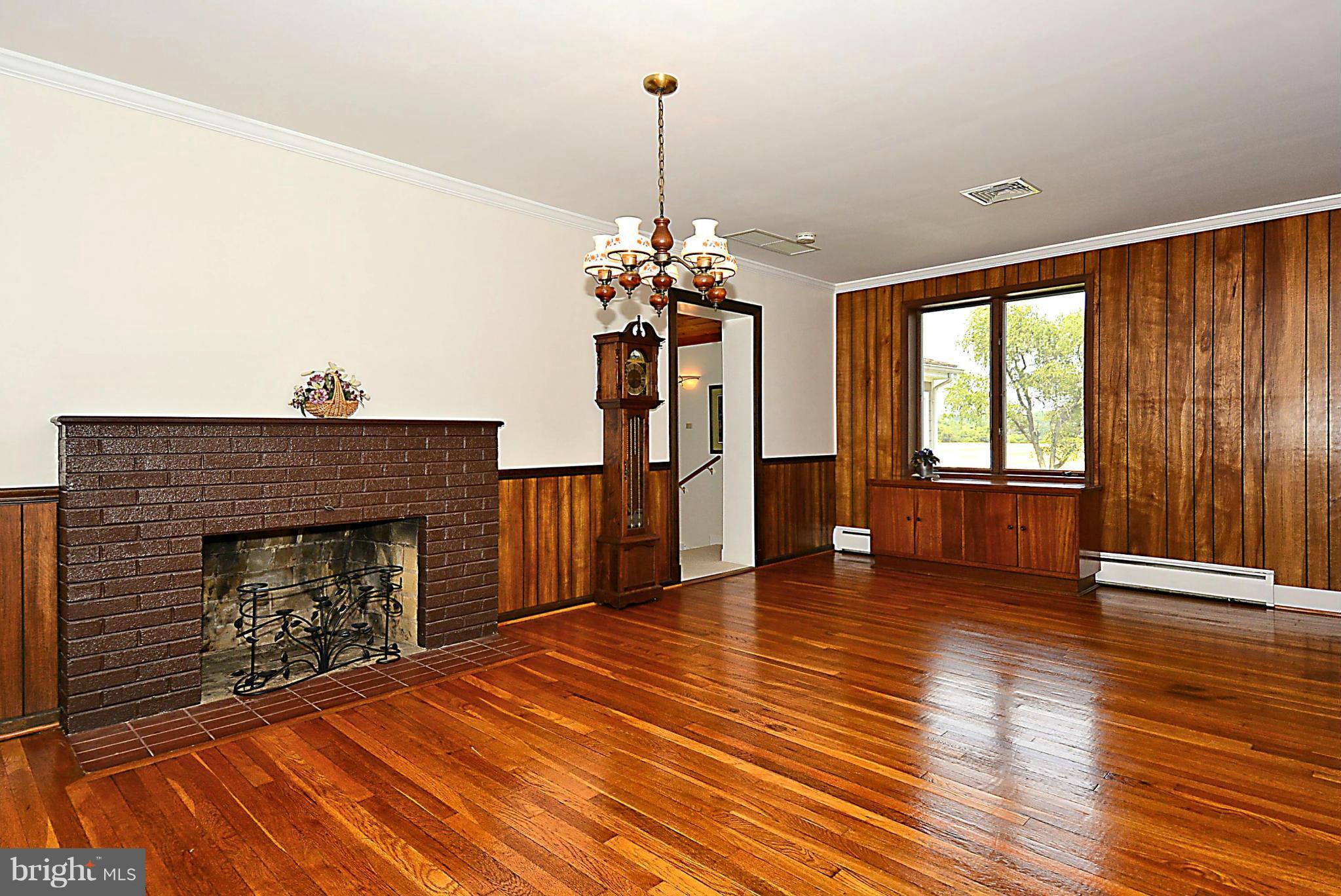 21121 Peach Tree Road Dickerson, MD 20842 - Photo 5 of 30 a view of a livingroom with wooden floor fireplace and a window