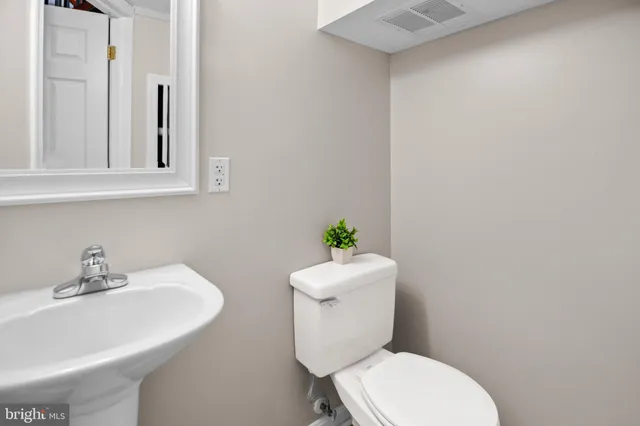 a bathroom with a granite countertop bathtub and shower