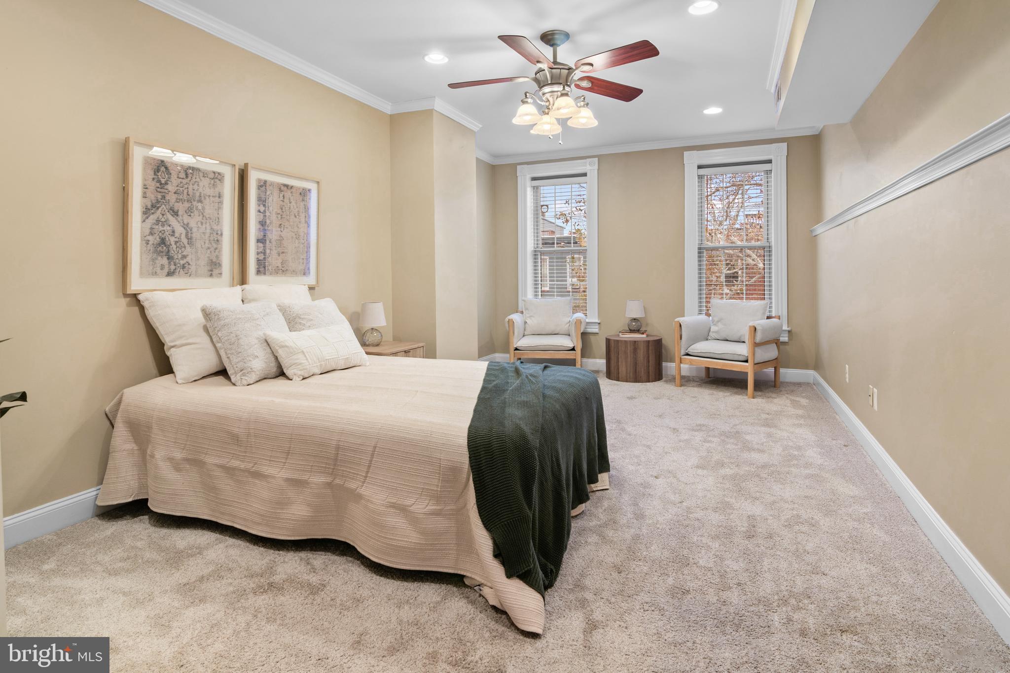 1535 South Hanover Street Baltimore, MD 21230 - Photo 16 of 43 a bedroom with a large bed and a chandelier