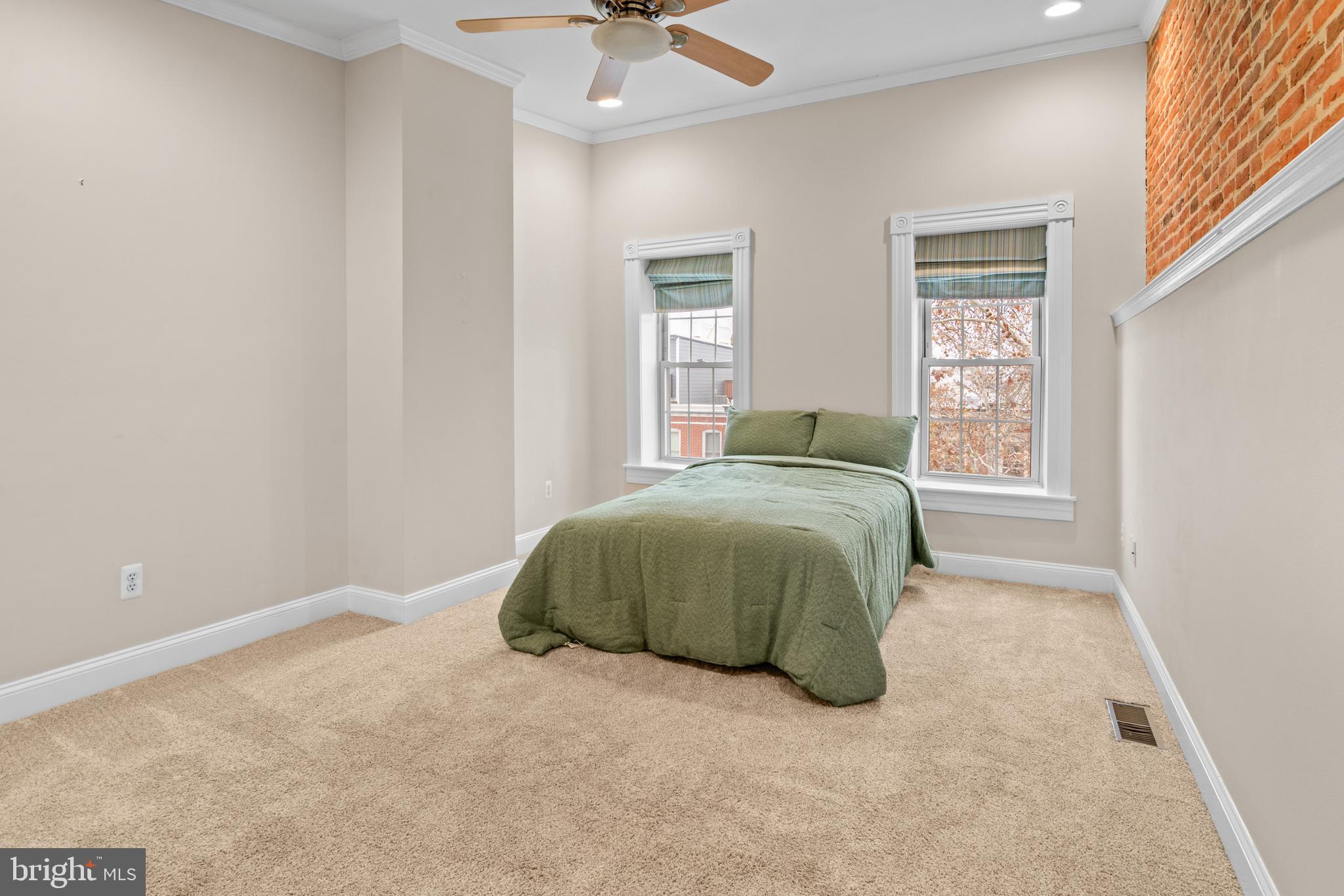 1535 South Hanover Street Baltimore, MD 21230 - Photo 24 of 43 a bedroom with a bed and window