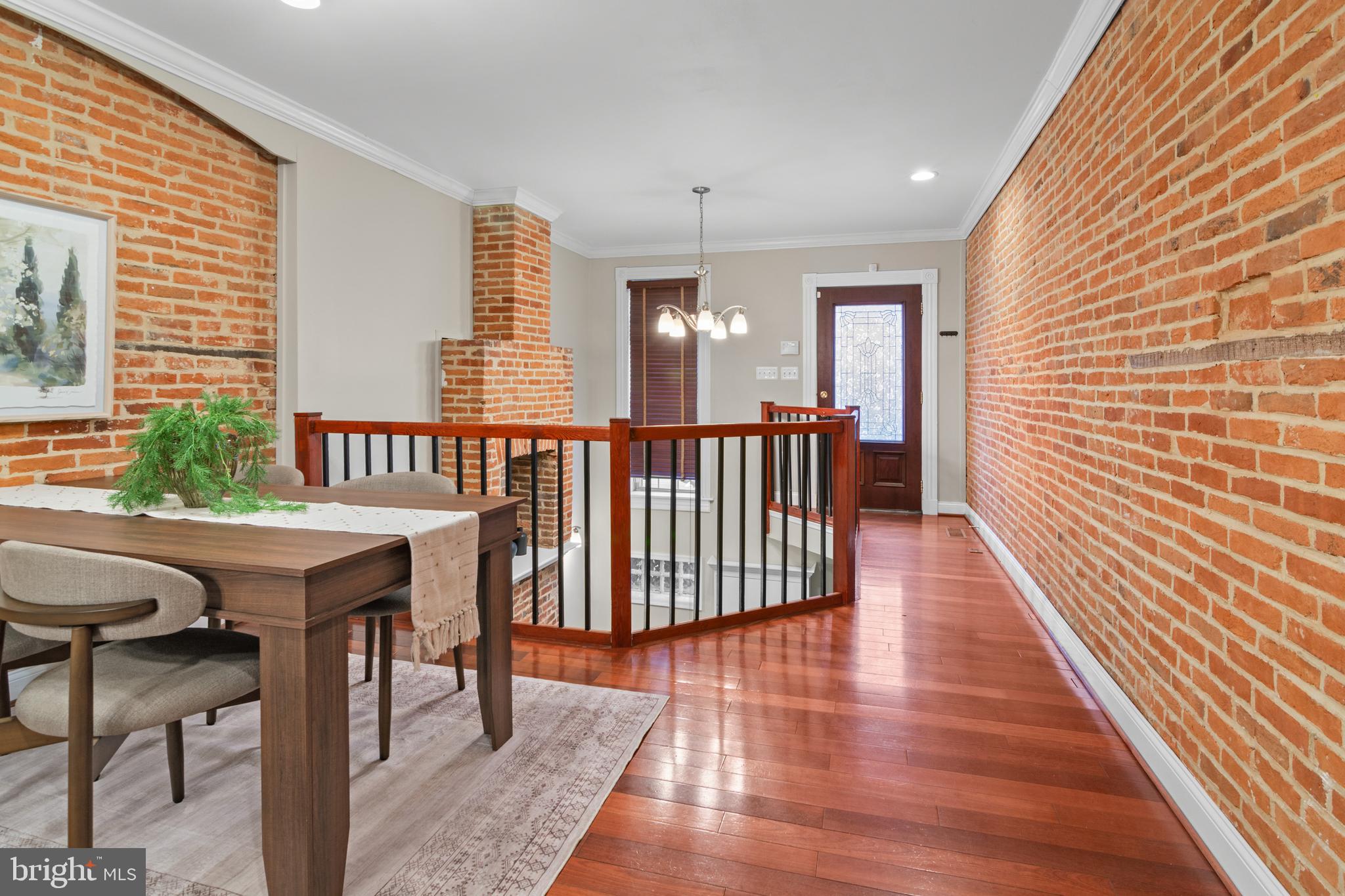 1535 South Hanover Street Baltimore, MD 21230 - Photo 3 of 43 a view of a balcony with furniture and wooden floor