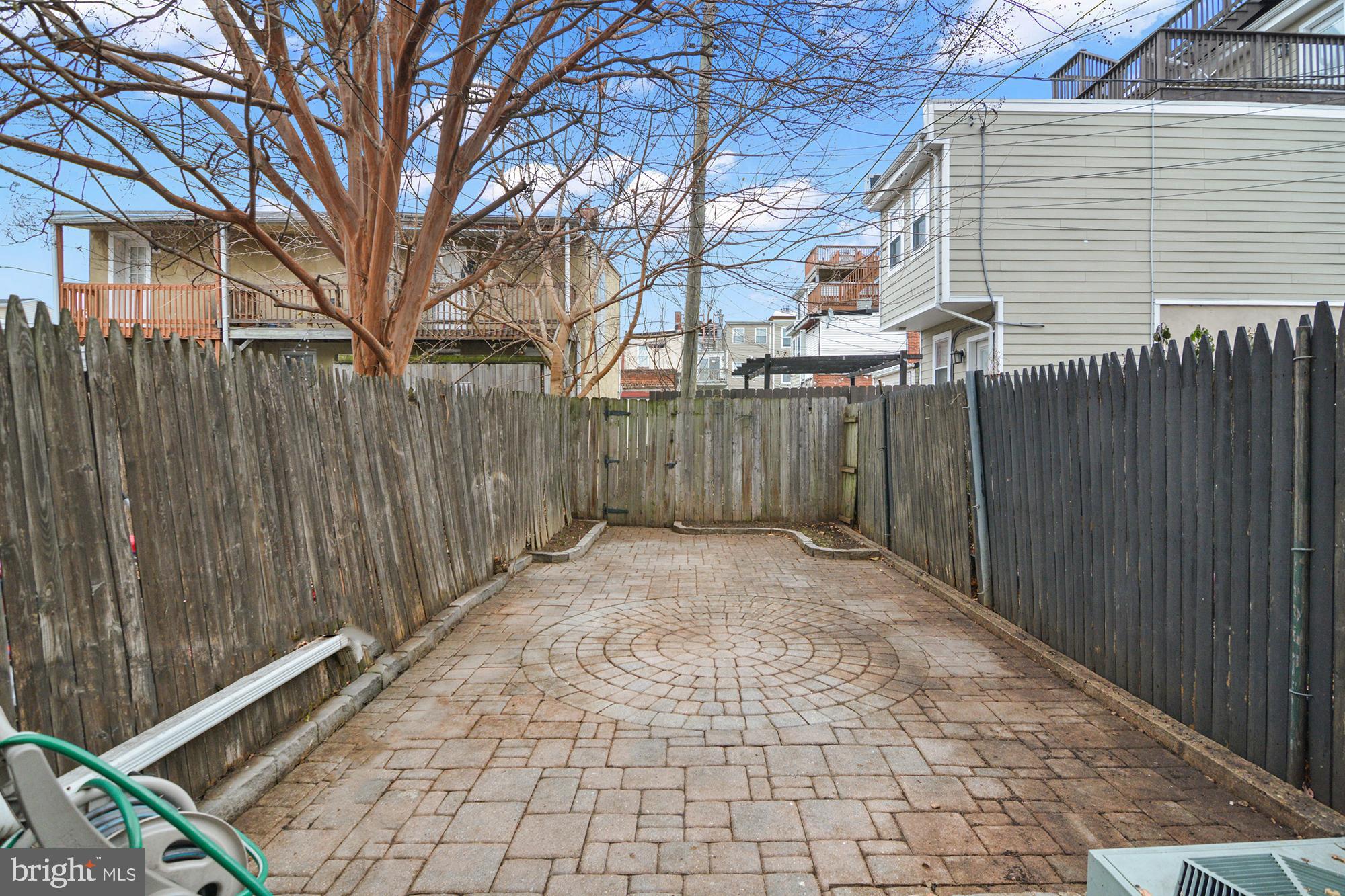 1535 South Hanover Street Baltimore, MD 21230 - Photo 36 of 43 a view of a backyard with wooden fence
