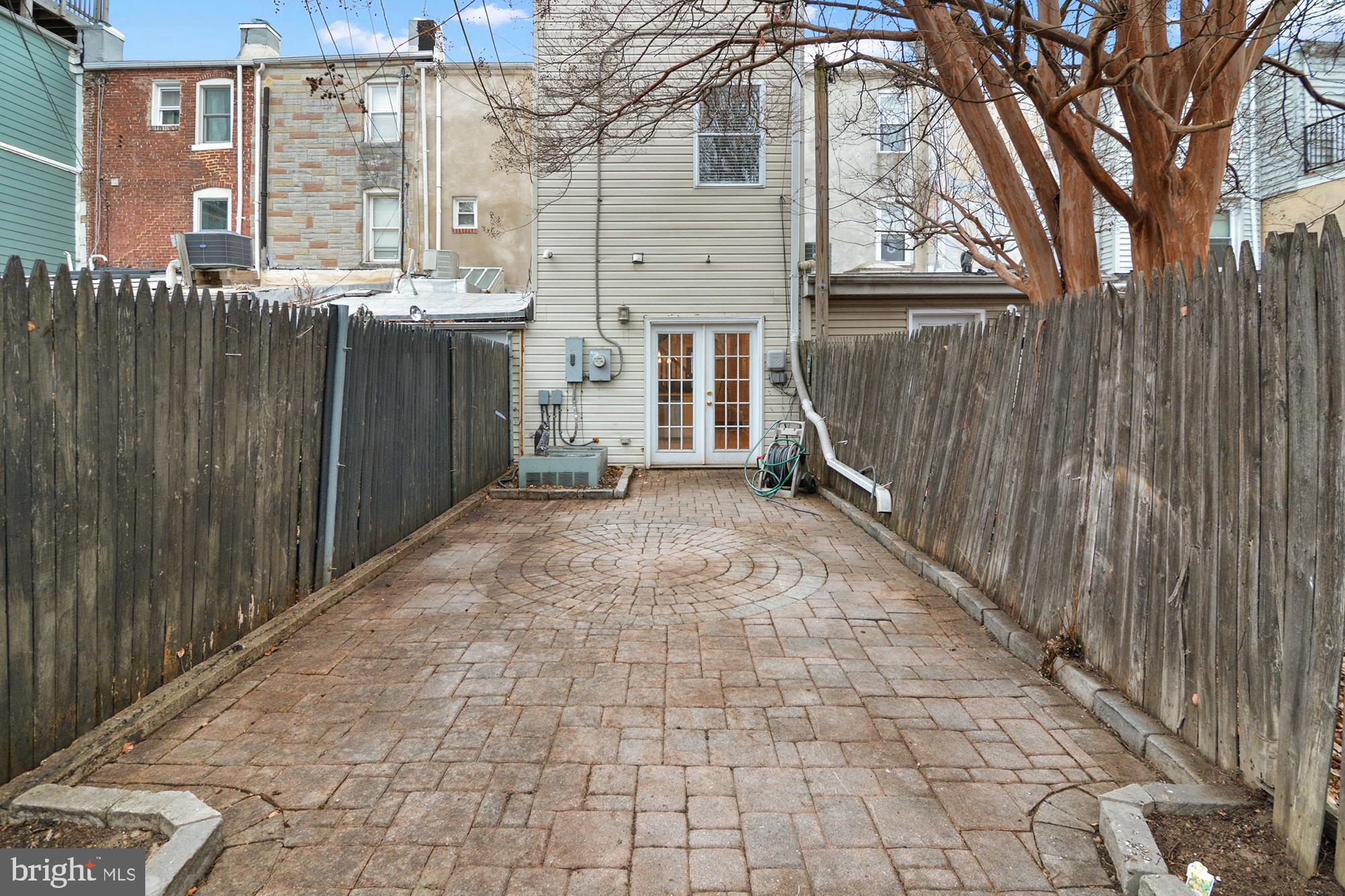 1535 South Hanover Street Baltimore, MD 21230 - Photo 37 of 43 a view of a brick house with a wooden fence