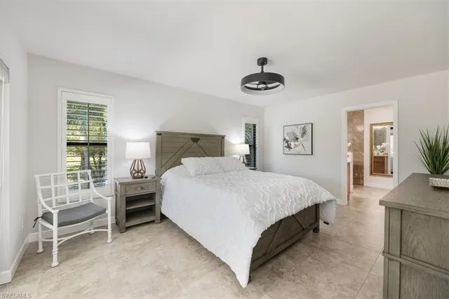 a large kitchen with stainless steel appliances lots of counter space and a sink