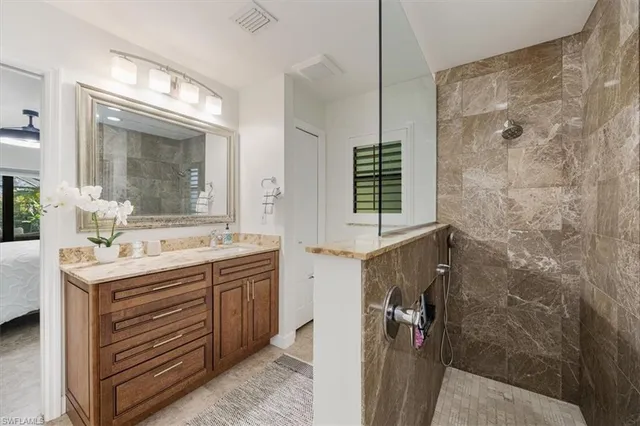 a bedroom with a bed and a chair