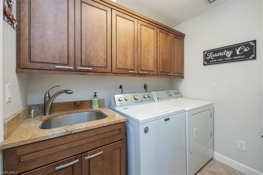 136 Old Tamiami Trail Naples, FL 34110 - Photo 17 of 24 a view of storage and utility room with washer and dryer