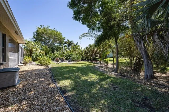 a view of a backyard with sitting area and furniture