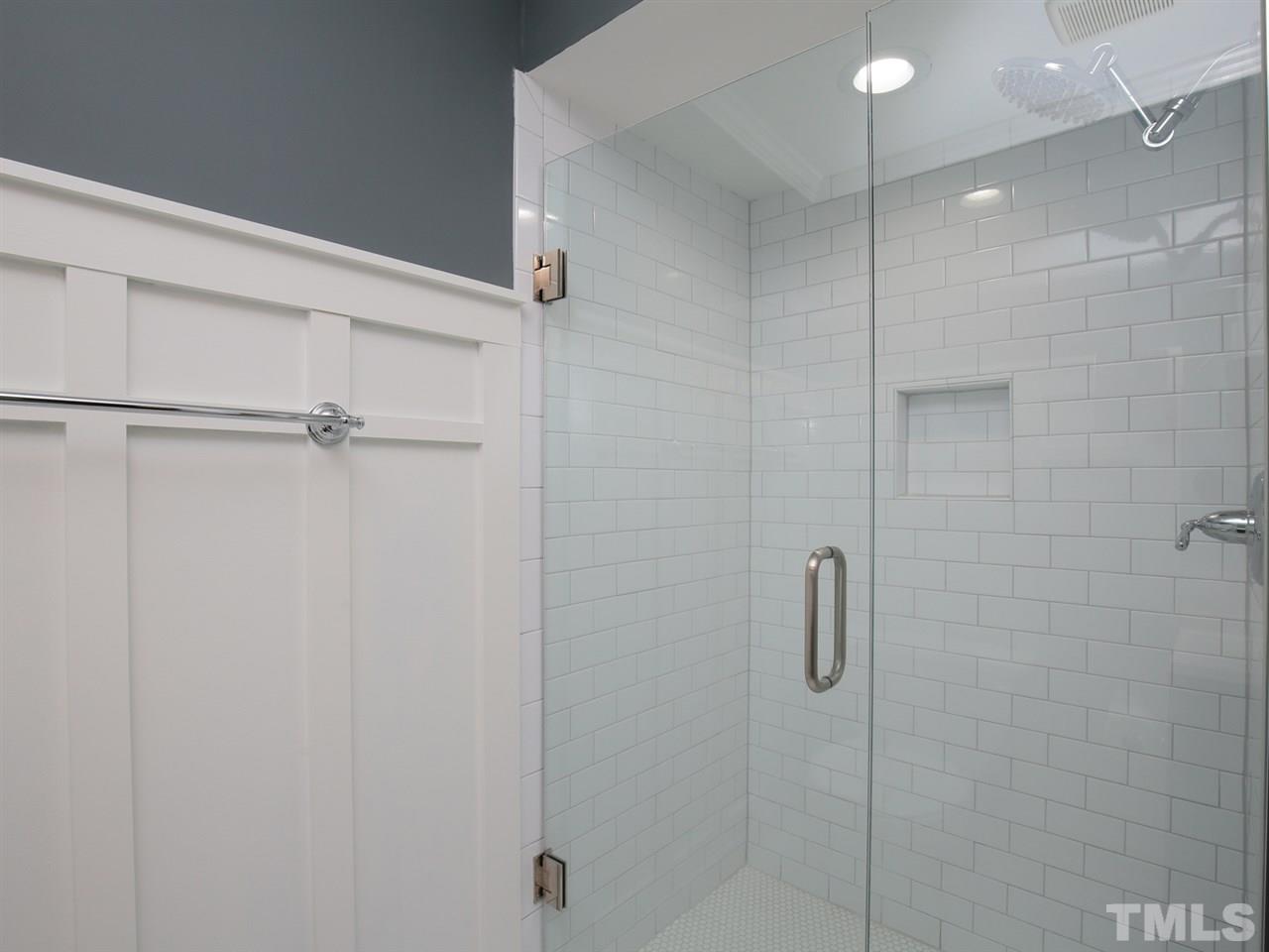 5509 Farmridge Road Raleigh, NC 27617 - Photo 14 of 23 a bathroom with a shower