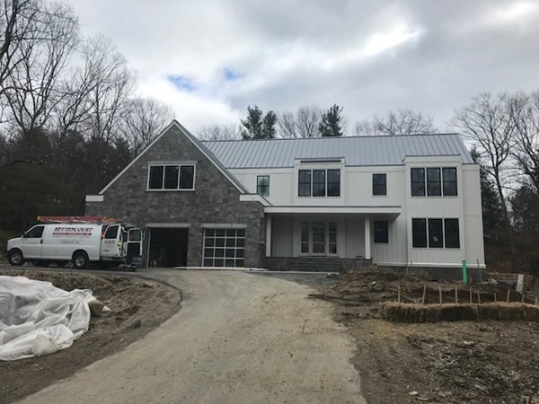 49 Falmouth Road Wellesley, MA 02481 - Photo 3 of 5 a front view of a house with a yard
