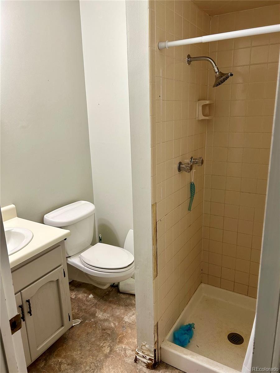 730 Ashley Road Craig, CO 81625 - Photo 13 of 43 a bathroom with a toilet and a shower