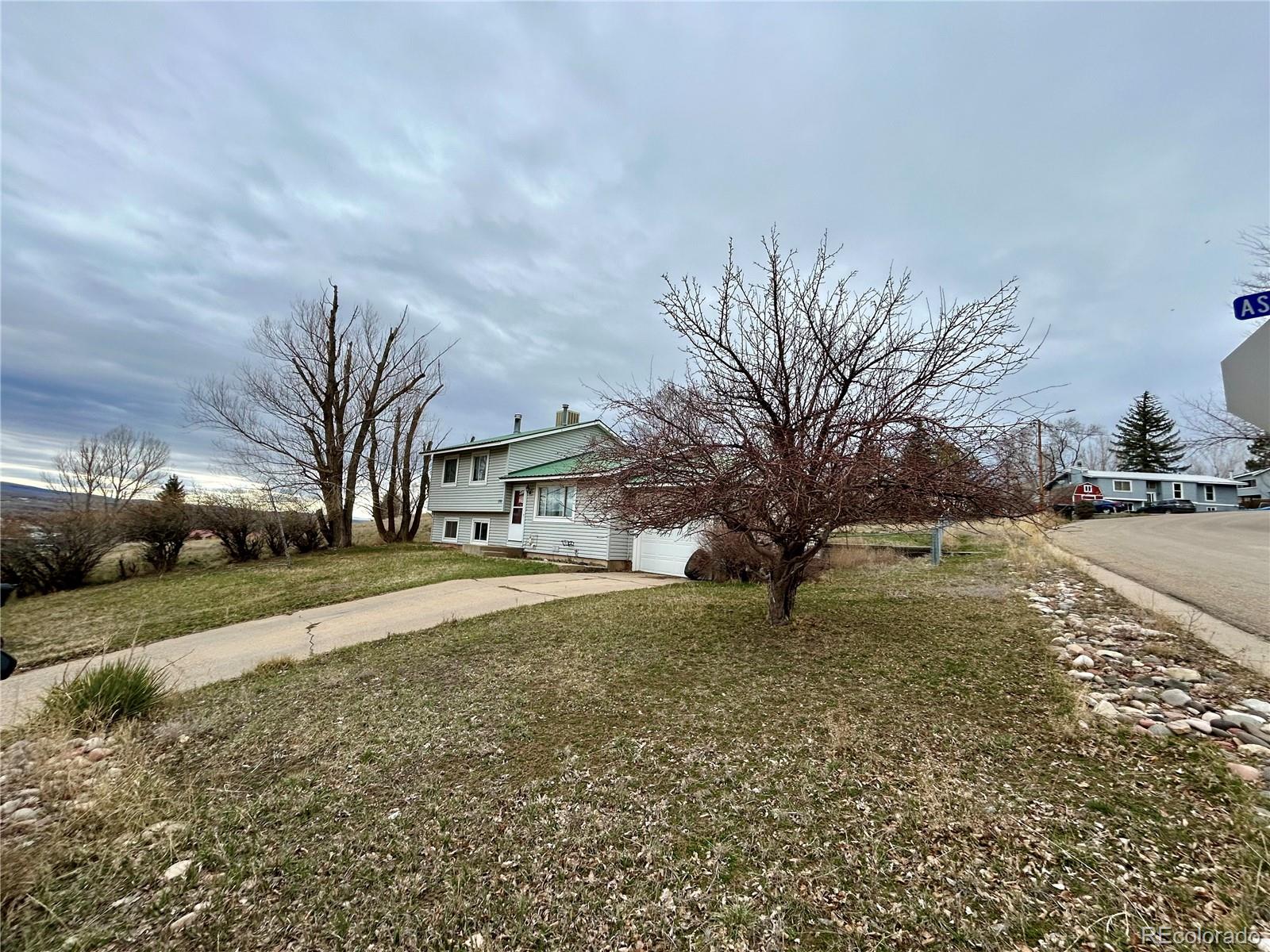 730 Ashley Road Craig, CO 81625 - Photo 33 of 43 a view of a yard with plants and trees