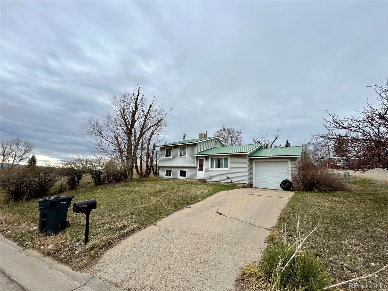 730 Ashley Road Craig, CO 81625 - Photo 34 of 43 a view of a house with backyard and sitting area