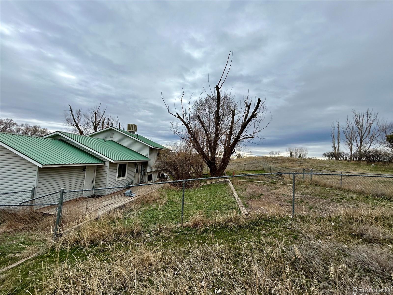 730 Ashley Road Craig, CO 81625 - Photo 37 of 43 a backyard of a house with table and chairs