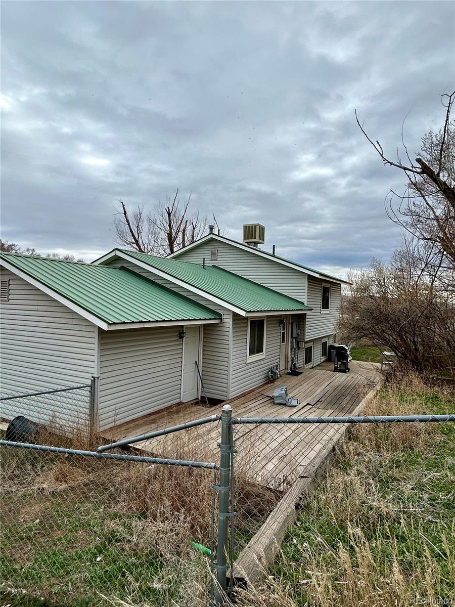 730 Ashley Road Craig, CO 81625 - Photo 38 of 43 a backyard of a house with table and chairs
