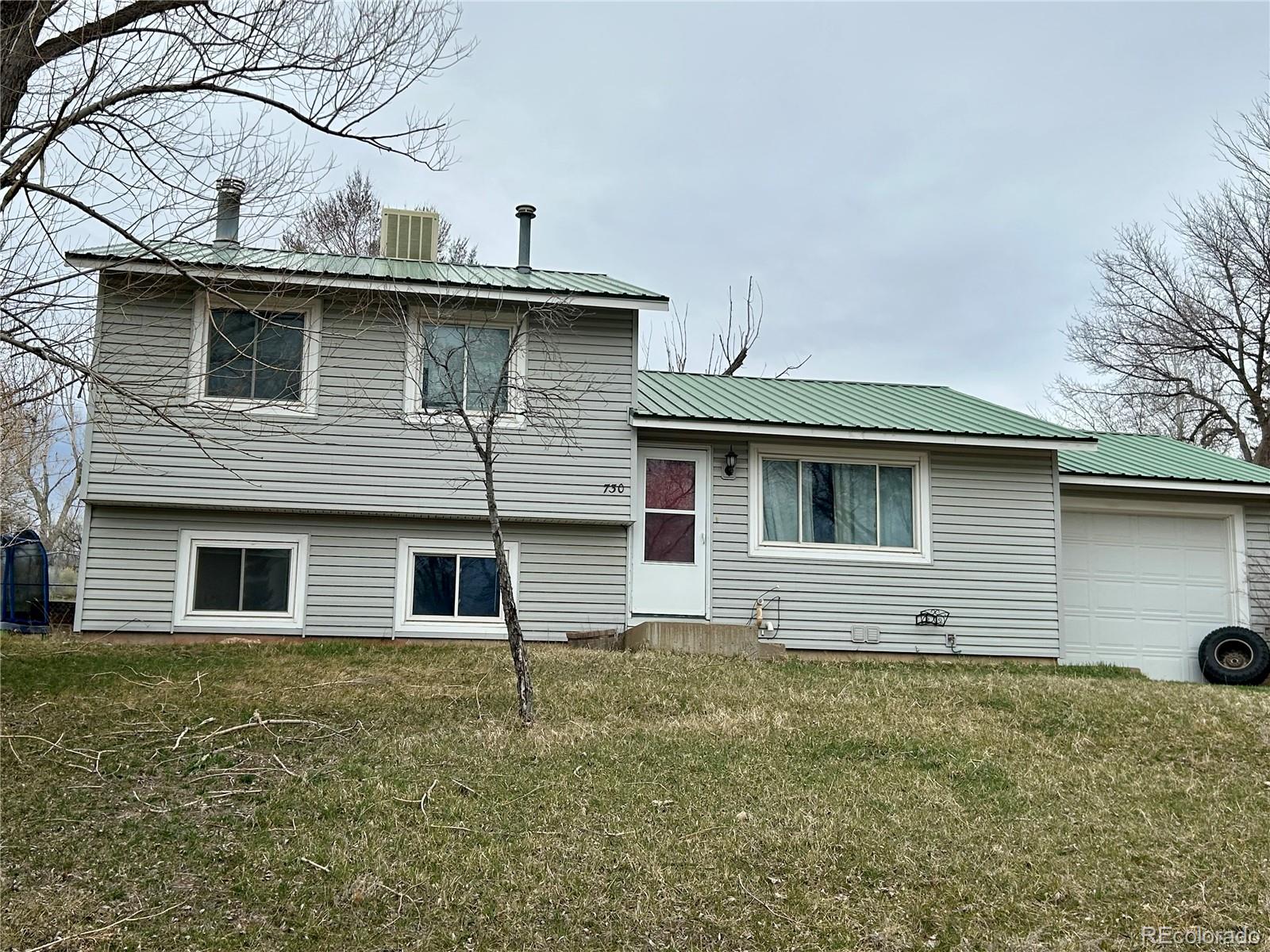 730 Ashley Road Craig, CO 81625 - Photo 43 of 43 a view of a house with a backyard