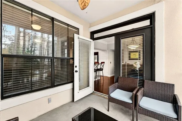 a view of front door and porch with furniture