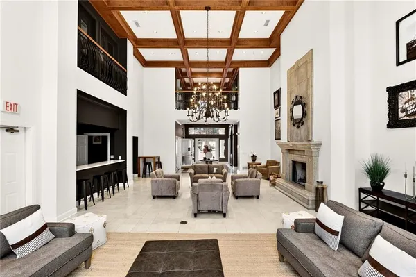 a living room with fireplace furniture and a window