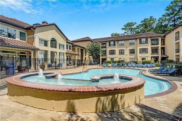 a front view of a house with swimming pool