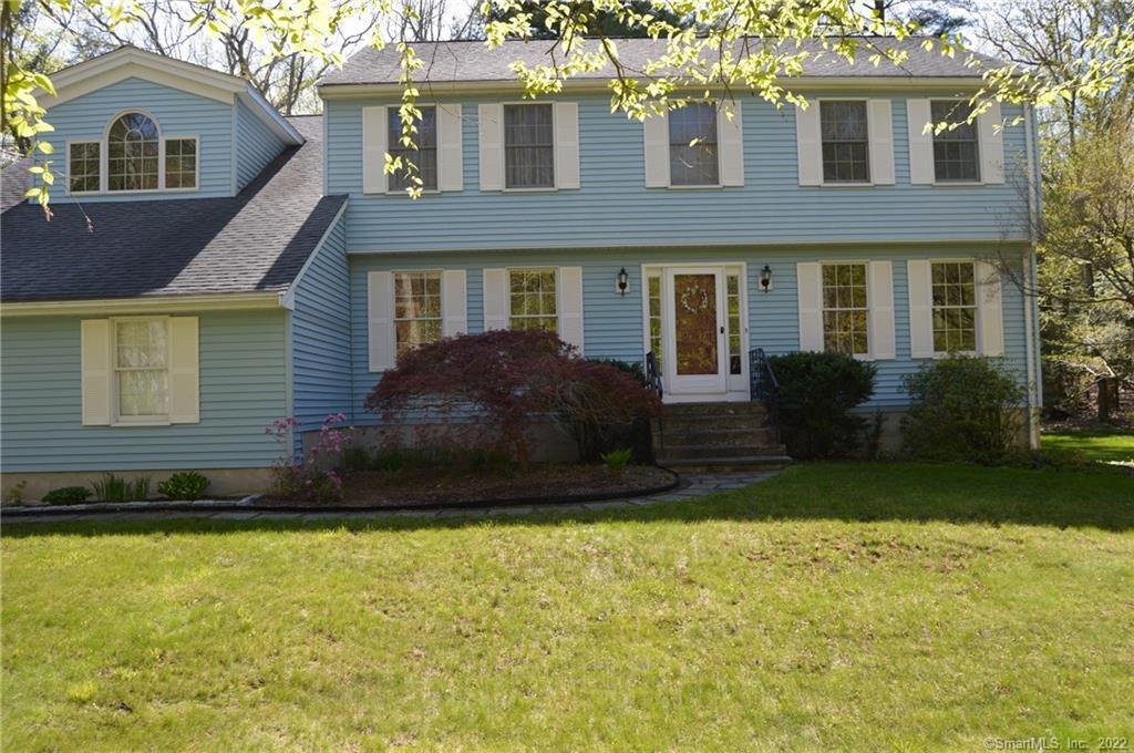 13 Park Road Simsbury, CT 06070 - Photo 1 of 1 a front view of a house with a yard and trees