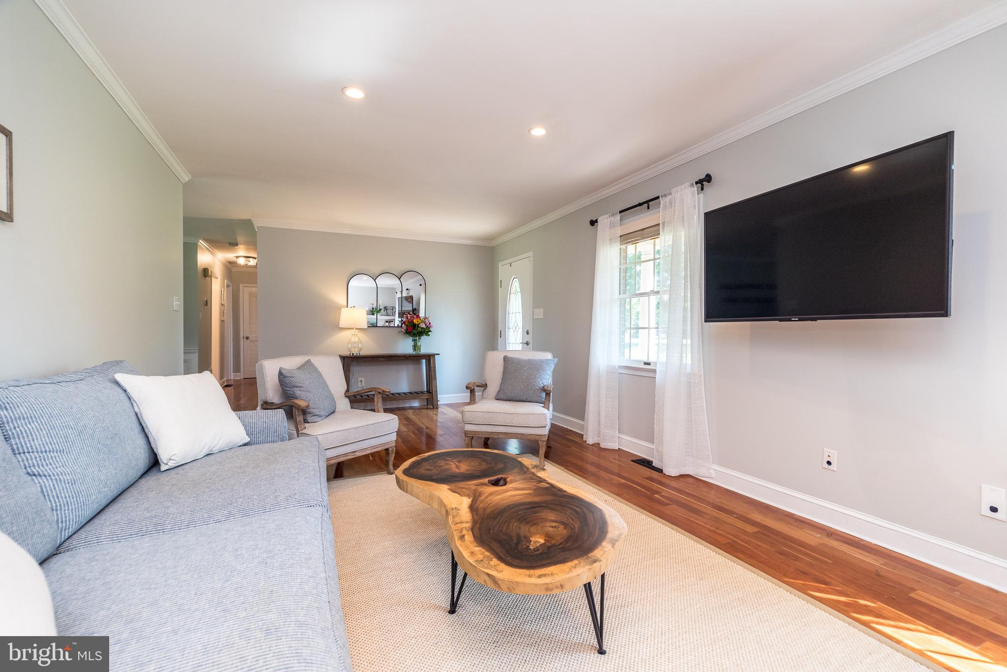 31 Longview Road Perkasie, PA 18944 - Photo 8 of 49 a living room with furniture and a flat screen tv