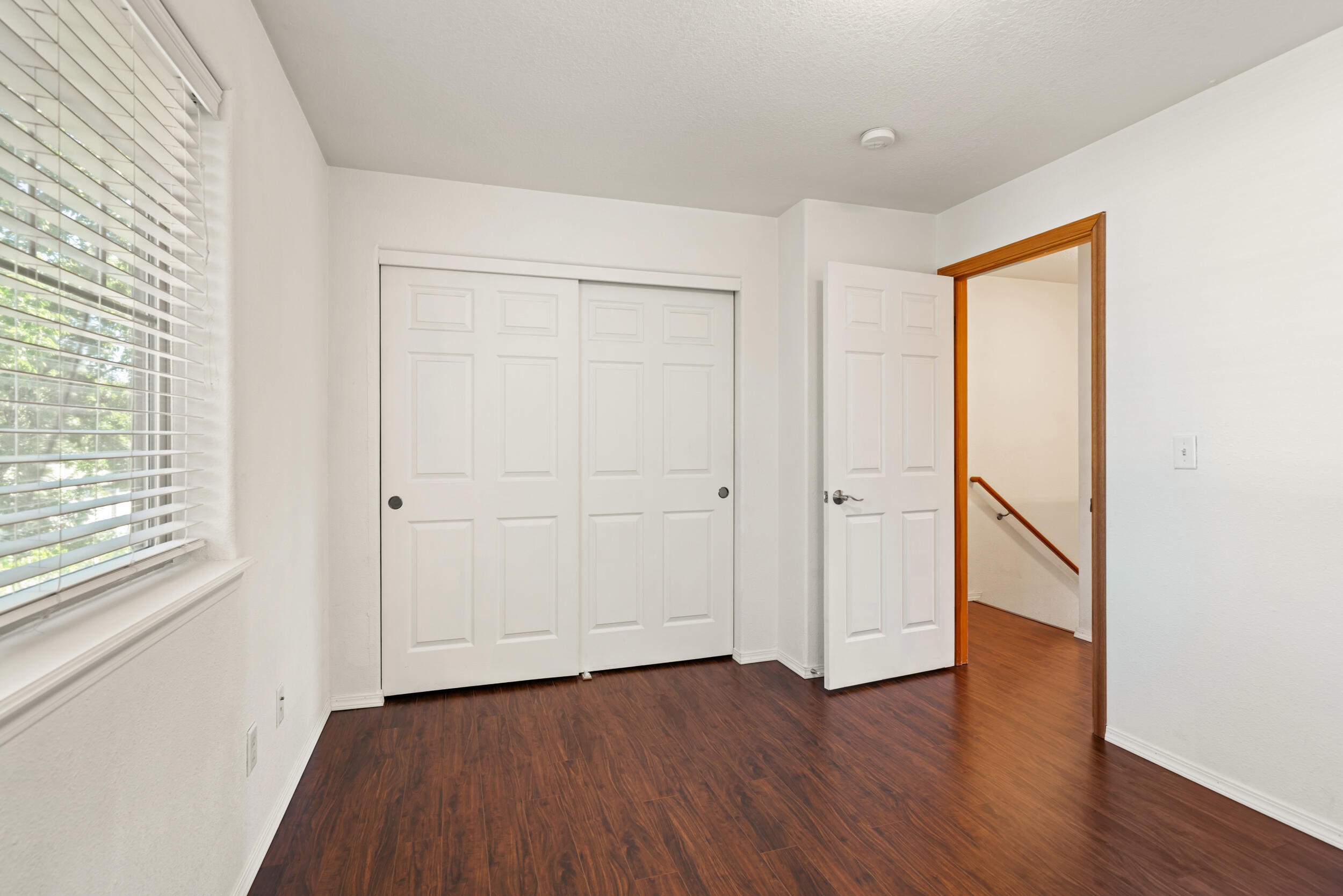 450 Midway Road, Unit 33 Medford, OR 97501 - Photo 14 of 21 a view of an empty room with wooden floor and a window