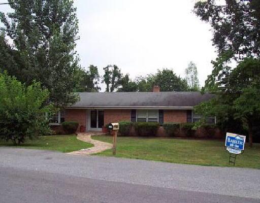 3526 Wedgewood Road Southwest Roanoke, VA 24018 - Photo 1 of 1 a front view of a house with a yard and garage
