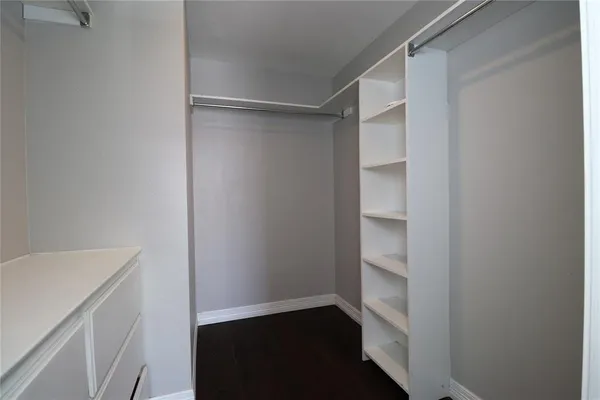 a view of an empty walk in closet