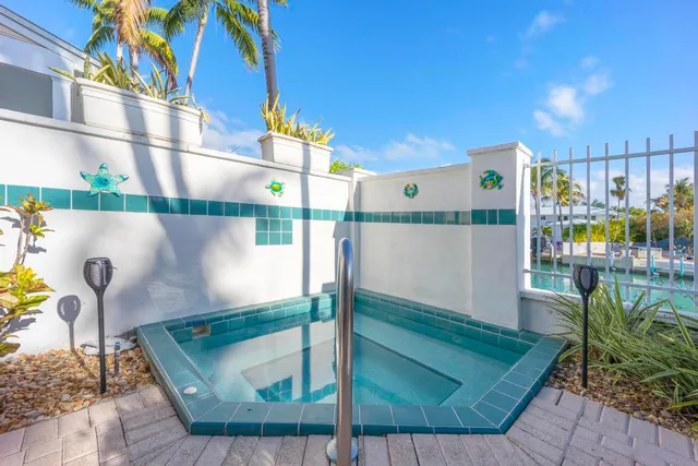 a outdoor dining space with furniture and wooden floor