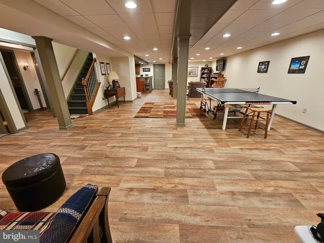 a room with furniture and a flat screen tv