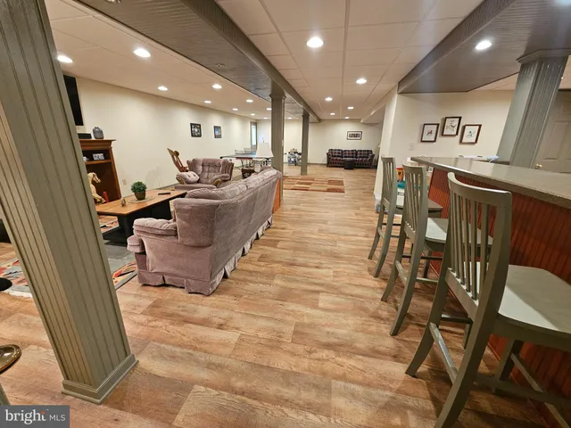 a lobby with furniture and a flat screen tv