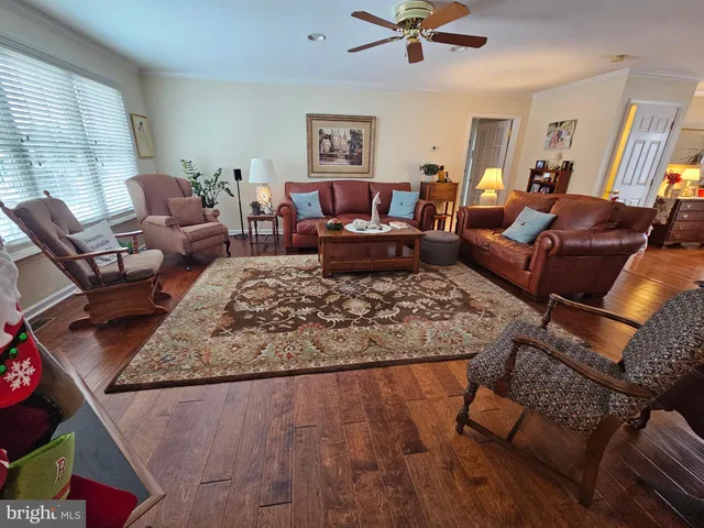 a living room with furniture rug and window